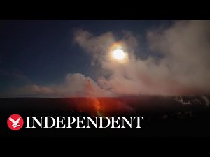 Bright moon sets over erupting Kilauea volcano after lunar eclipse