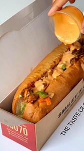 Turn up the heat with our Mexican Chicken Sandwich! Grilled chicken spiced with hot Mexican salsa, topped with a colorful array of veggies, and drizzled with BBQ sauce. Order online at smileysgrill.com or call us on 16070 | Smiley's Grill