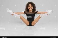 young legs girl sitting wide gymnast female socks floor professional smiling flexibility curly knee hair alamy sportswear isolated showing gray