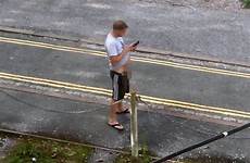 street caught peeing man phone his wee using hands having while star daily
