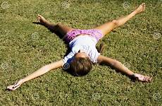 girl grass legs arms young her stretching mown lies field stock preview