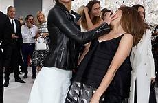 jennifer emma watson face lawrence dior couture haute show her she martin chris hand fashion paris katniss together christian having