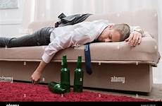 drunk sleeping man couch sleep stock room alamy alcohol sofa living after