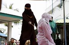 lashes sex punishment indonesia couple woman sharia whipped marriage having aceh given before crimes stoning law lashed marital pre