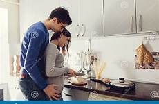 kitchen couple hugging cooking dinner young dreamstime girl