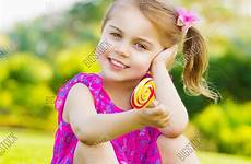 little girl cute lollipop sitting flickr child stock