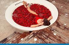 swimwear red petals relax jacuzzi lying spa bikini round rose health beauty woman beautiful girl preview