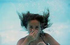underwater girl breath holding her stocksy while
