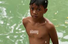 boy filipino swim pond alamy stands near after stock shopping cart