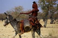 donkey woman himba animals road poor