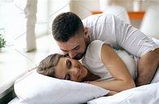 bed couple kiss morning loving hug wife man wake beautiful his young attractive people