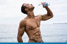 water shirtless chest bottle plastic pouring muscleman attractive his beach down