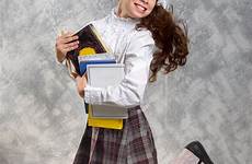 schoolgirl fidget happily textbooks