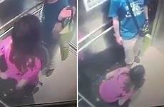 caught urinating woman cctv lift looks mirror companion holds bag male