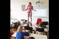teacher anatomy bodysuit human revealing strips teach wears down lesson class cnn dutch