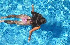 pool woman girl floating beautiful young hotel across