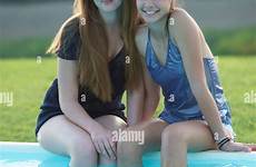 poolside girls italy two teenage alamy sitting tuscany