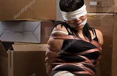 kidnapped woman being stock tied blindfolded depositphotos