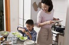 kitchen mother role cook family son typical american mom cooking safety food know her where healthy kid child principles every