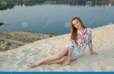 smiles charming sand town lake near woman preview