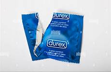 condom wrapper durex pack ripped alamy stock