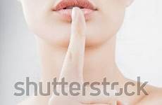 lips finger put her girl sign secrecy closeup silence