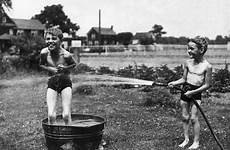 summer vintage water fun boy kids playing hose outdoors washtub 1947 show swim 1950 1970 trunks looked internet yard before