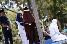 caned cane publicly terrified brutally cops aceh ragazzi sesso fanno mentre sorpresi punishable