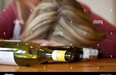 drunk woman passed blonde bottles alamy empty alcohol stock young dancing