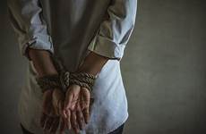 tied hands behind back woman her hand rope cut stock