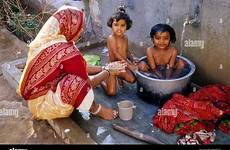 bathing india mother indian kids washing public bucket her village daughters gujarat bhujodi stock alamy hot