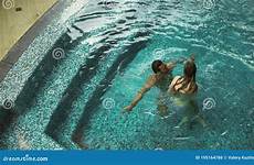 flirting pool couple woman