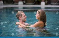 pool swimming couple attractive man stock girlfriend standing each looking woman other preview dreamstime