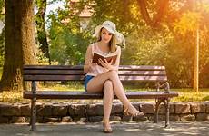 sitting bench reading woman book stock format people