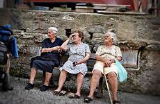 italian italy ladies women elderly bench old sitting three vintage europe girls miseria park people photoshelter fine vernazza porca benches