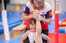 gymnastics stretching coach gymnast stretches russi prepares moscow alamy