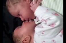 twins kissing