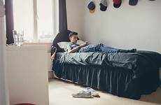 teenager kid boy college bed masturbation using his teenage smartphone parents stock teen sexting teens why lying baby old year