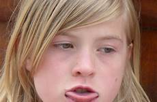 tongue girl lick mouth face puberty model teenager rough long consider red close expressions hair cheek facial expression lip skin