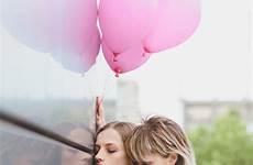 sensual lesbian couple balloons stock embracing kissing embrace intimate closed eyes outdoors holding air depositphotos