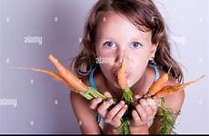 eating girl carrots stock alamy fresh child sweet young white