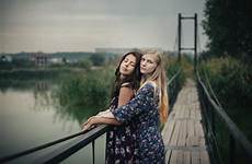 lesbian outdoors couple concept together bridge beautiful evening preview