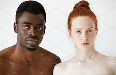 man woman african looking caucasian standing interracial mixed shirtless couple camera young portrait headshot beautiful race serious people male expression