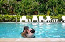 pool kissing swimming couple