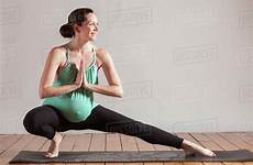 yoga pregnant pose lunge women side doing prayer stretching massachusetts boston hands usa dissolve stock d1129