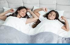 mother daughter bed young cute beautiful her stretchin woke both together teen just