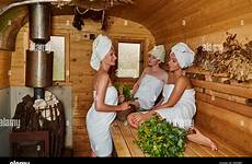 sauna girls stock alamy three young finland relaxing towels