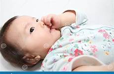 sucking finger her girl japanese baby stock