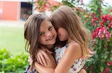 girls hugging little two stock children friend girl kids rivalry sibling kid much format don too force groups change them