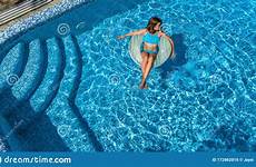 inflatable swims relaxes donut aerial swimming hat pool ring above woman young beautiful girl fun has relaxation people